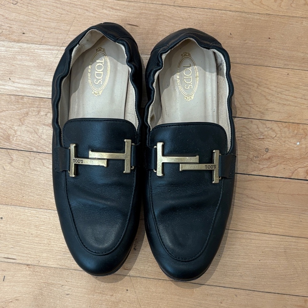 Tod's Black Leather Slip-On Loafers with Gold Accent
